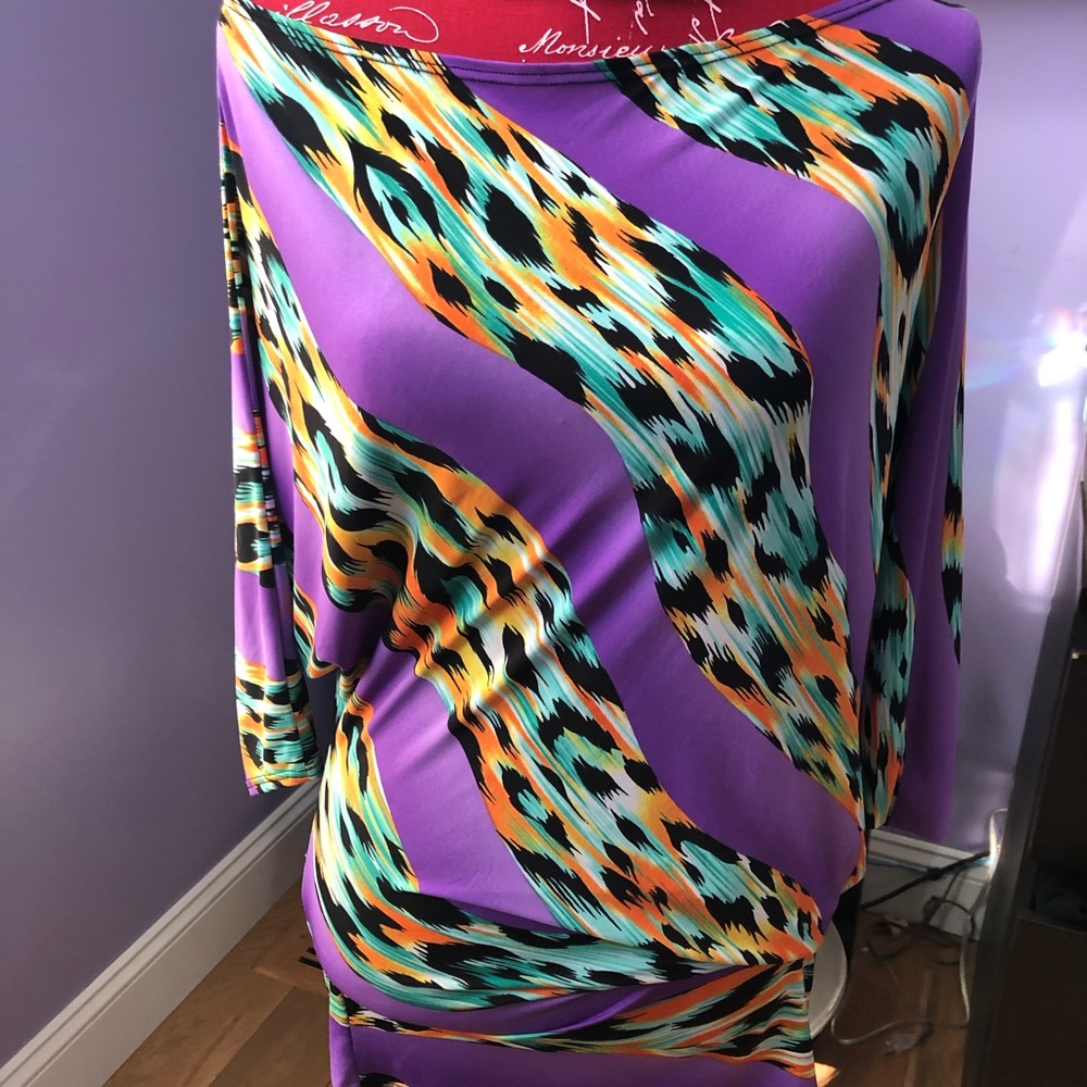 Asymmetrical, vivid, hot blouse.